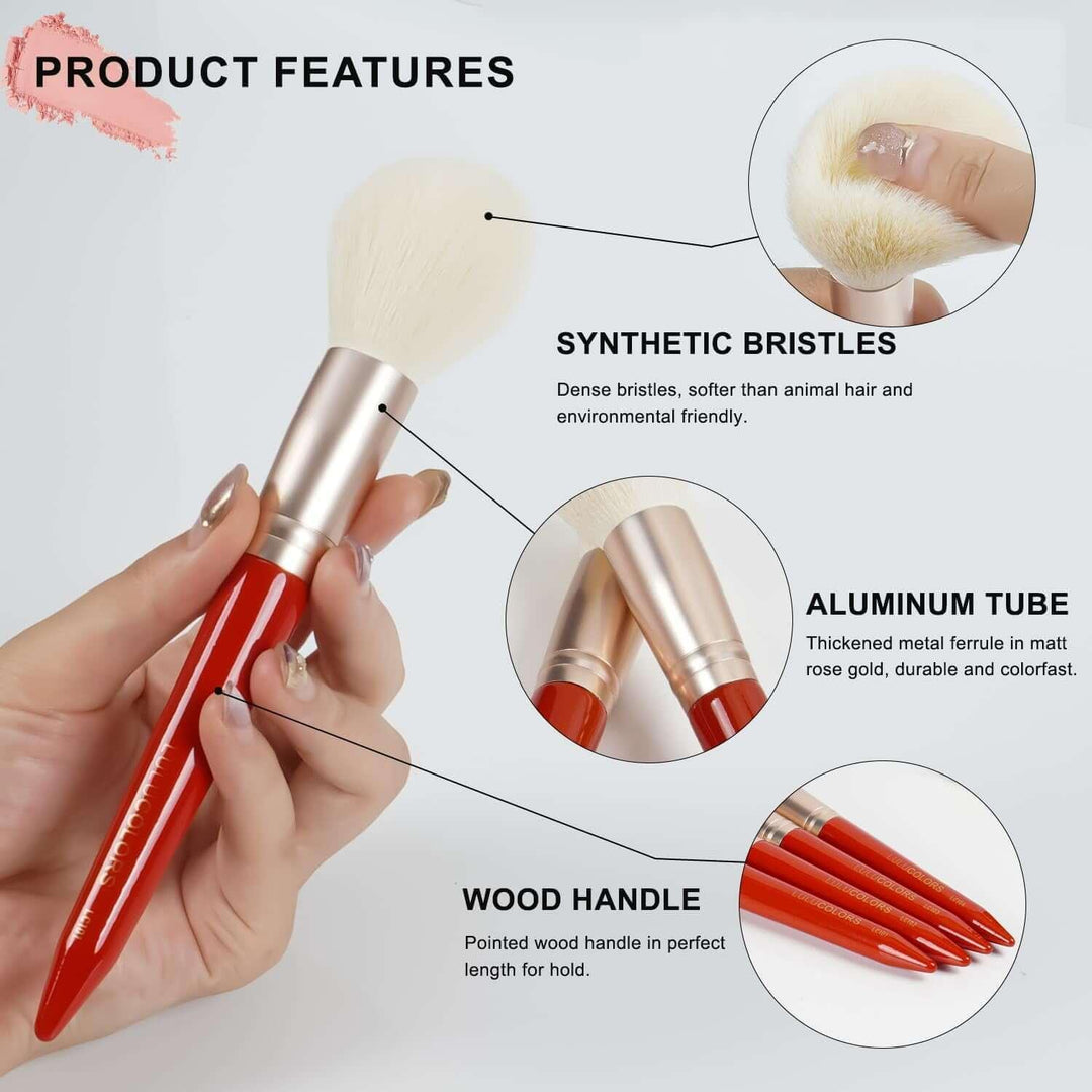 Makeup brush with synthetic bristles, matt rose gold aluminum tube, and red pointed wood handle