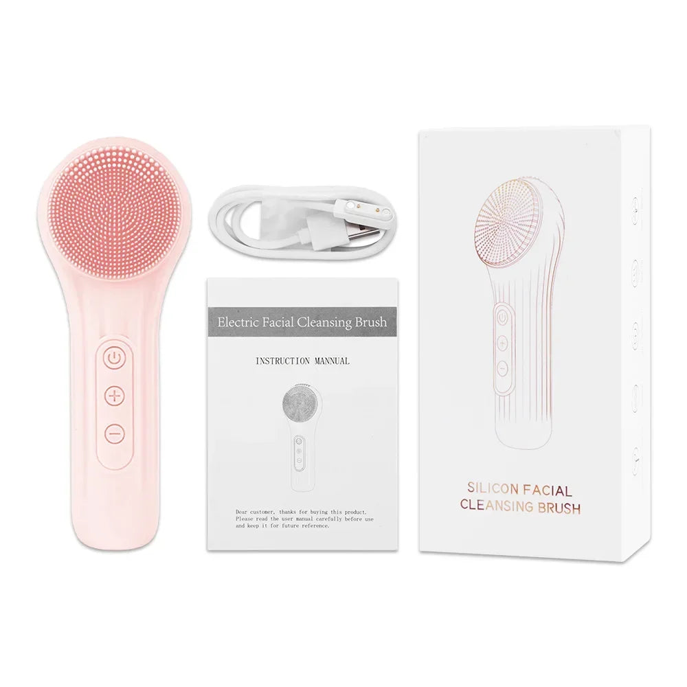 Pink electric silicone facial cleansing brush with USB charging cable, manual, and packaging box