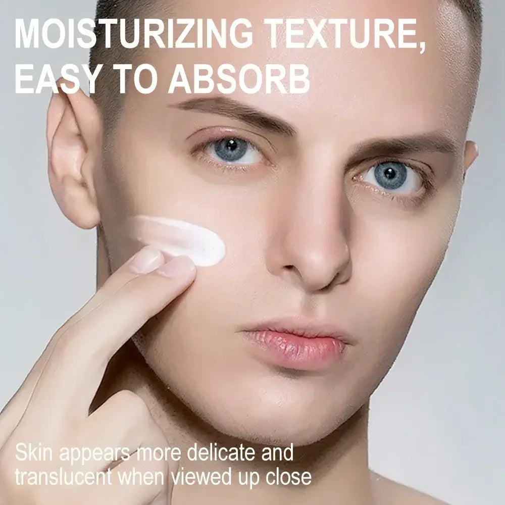 Close-up of man applying moisturizing cream on face with smooth, delicate skin