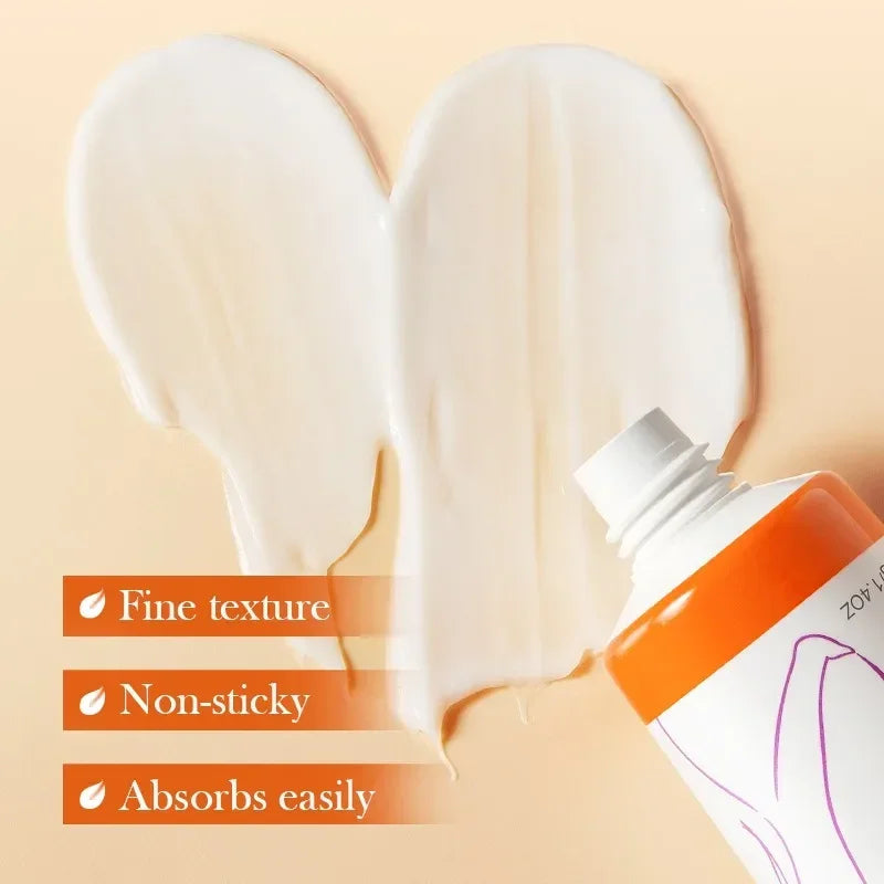 Close-up of white cream spread and orange skincare tube highlighting fine texture, non-sticky, easily absorbed