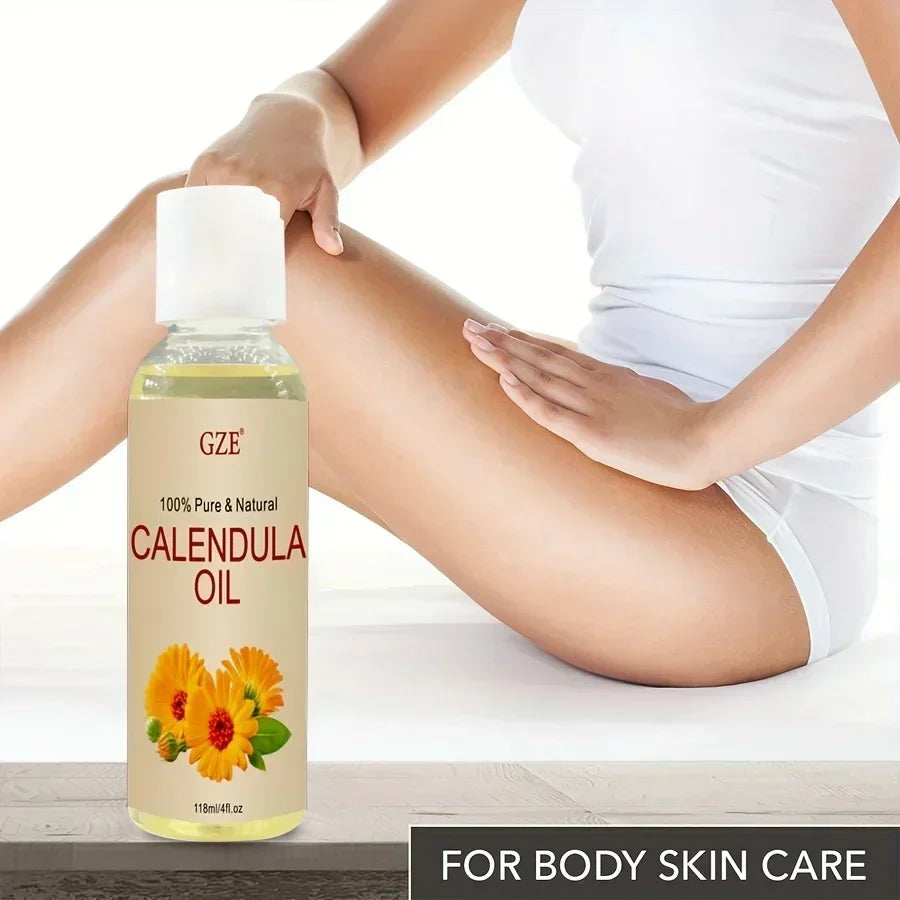 Bottle of 100% pure calendula oil for body skin care with a person applying it on smooth legs