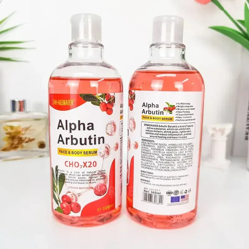 Two bottles of Alpha Arbutin Face & Body Serum with red liquid, white labels, and cranberry graphics