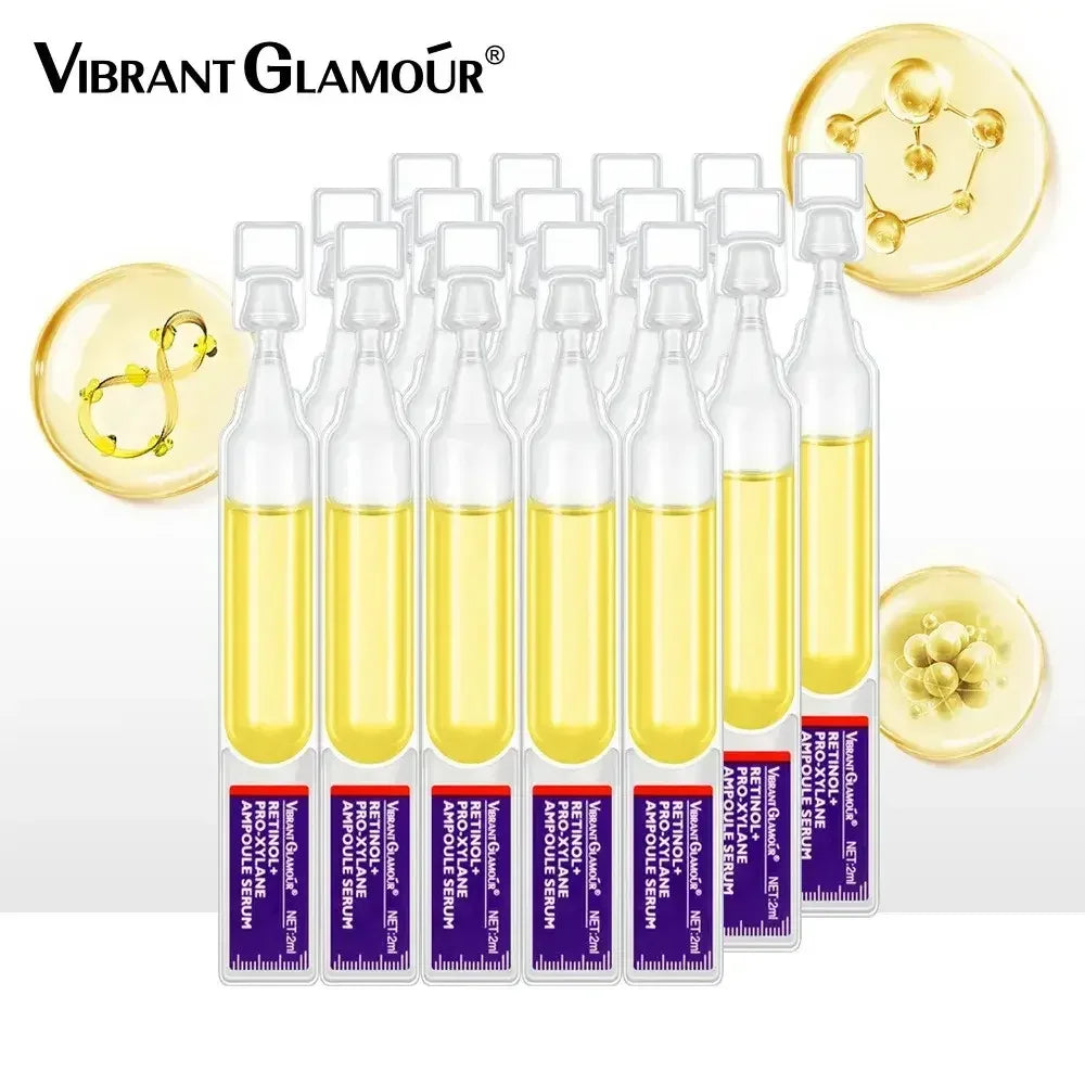 Set of Vibrant Glamour Retinol Pro-xylane ampoule serums with yellow liquid in clear bottles