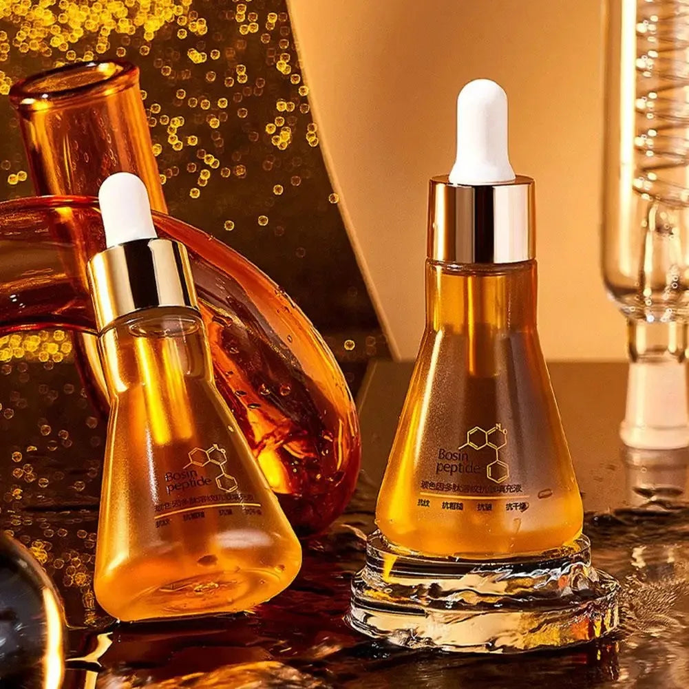 Amber glass dropper bottles of Bosin peptide serum on reflective surface with golden background