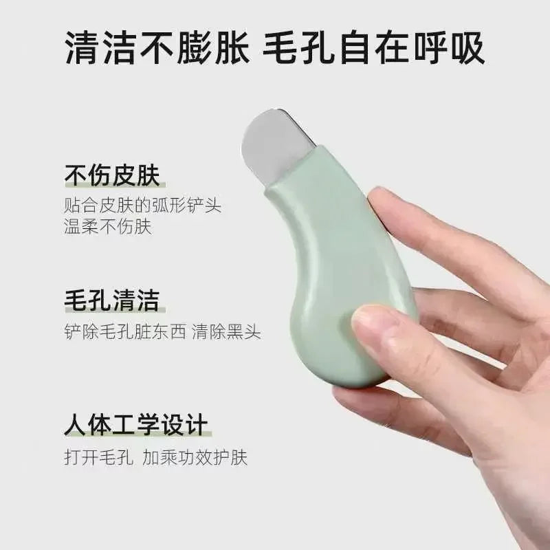 Hand holding a green facial pore cleanser tool with ergonomic design, metal blade for blackhead removal