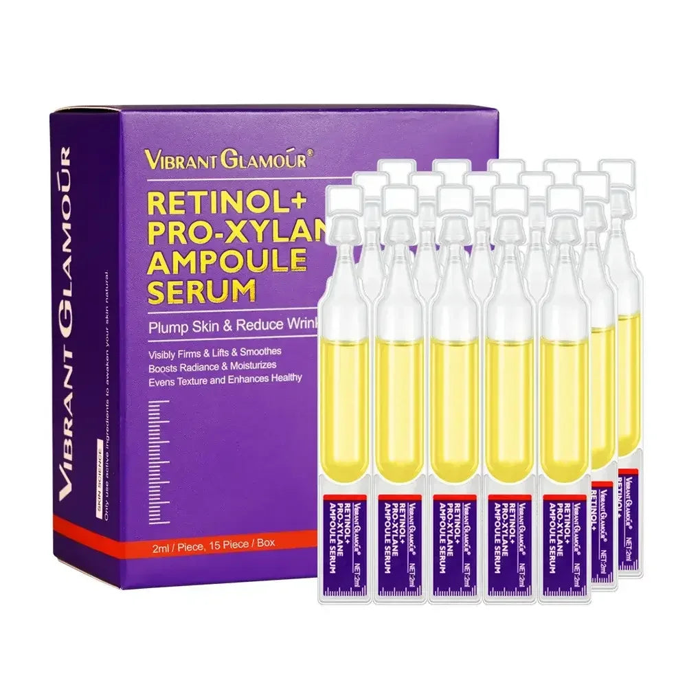 Vibrant Glamour Retinol Pro-Xylan Ampoule Serum box with 15 clear vials of yellow skincare serum