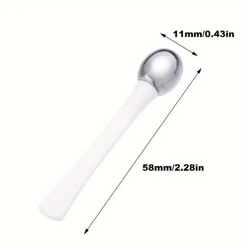 White handheld beauty tool with metal rounded tip, measuring 58mm by 11mm