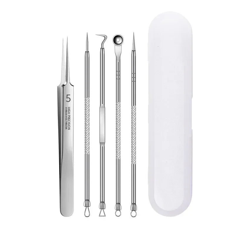 Set of 5 stainless steel blackhead removal tools with precision tips and white plastic storage case