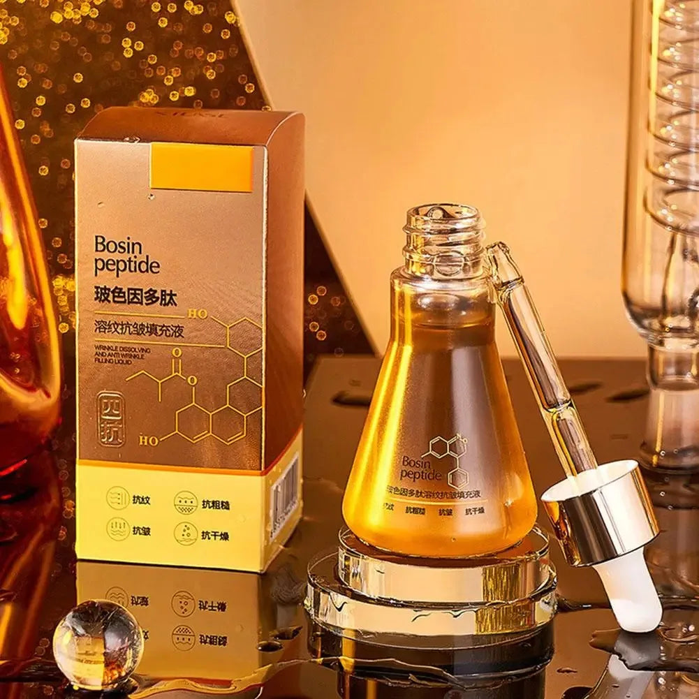 Bosin Peptide skincare serum bottle with dropper and matching box on reflective golden surface