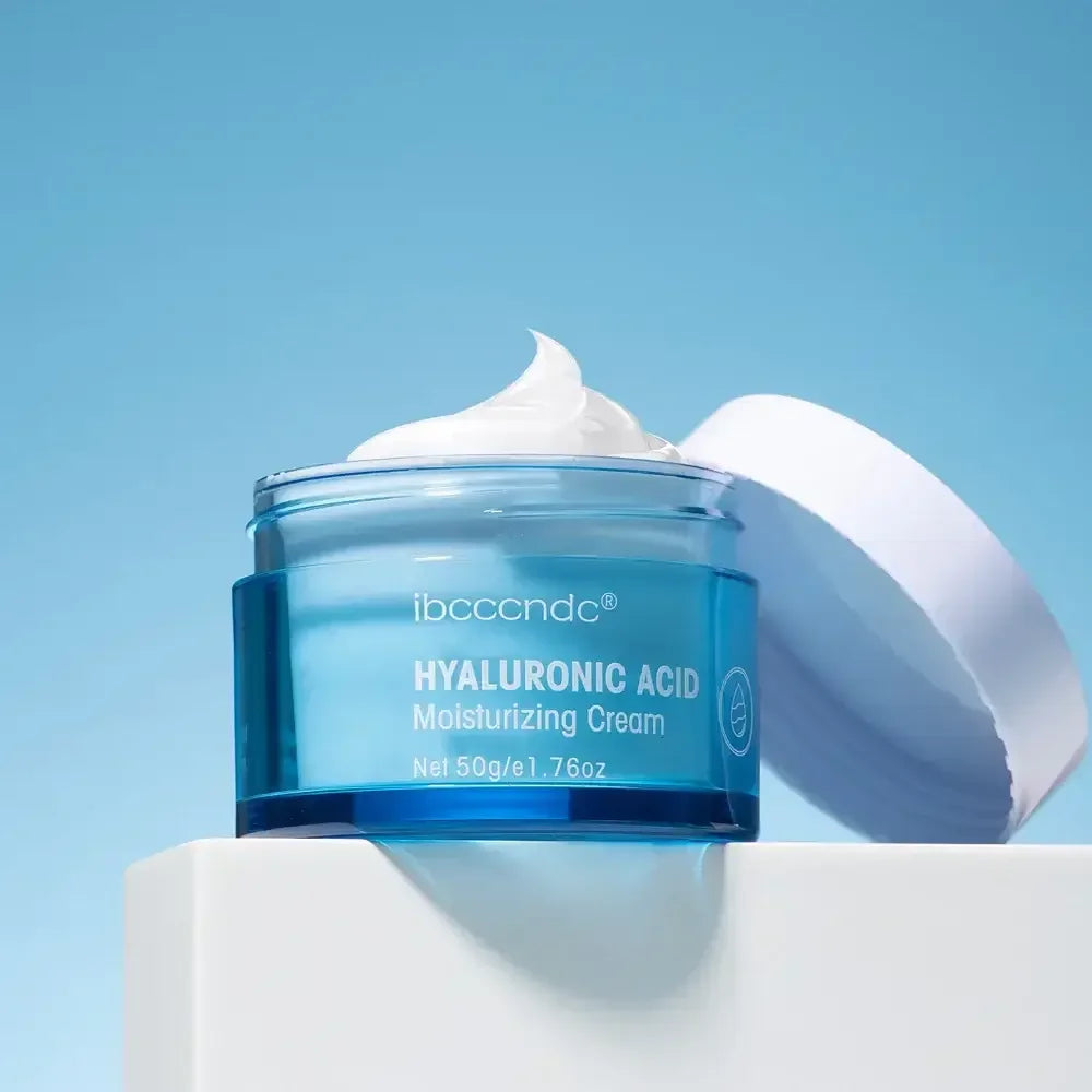 Open blue jar of ibcccndc Hyaluronic Acid moisturizing cream with white lid on white platform