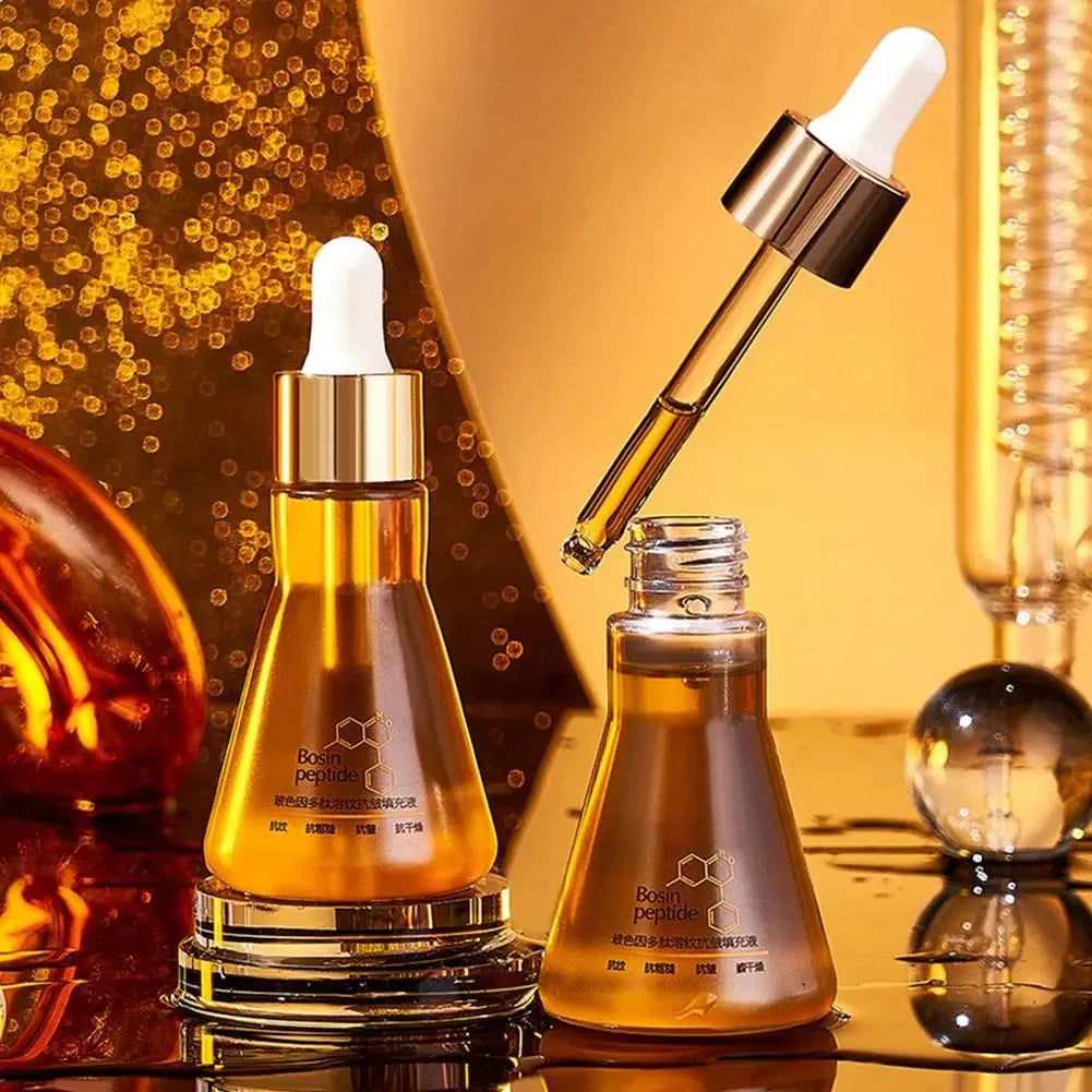 Bosin peptide skincare serum with dropper and golden liquid in amber glass bottles on reflective surface