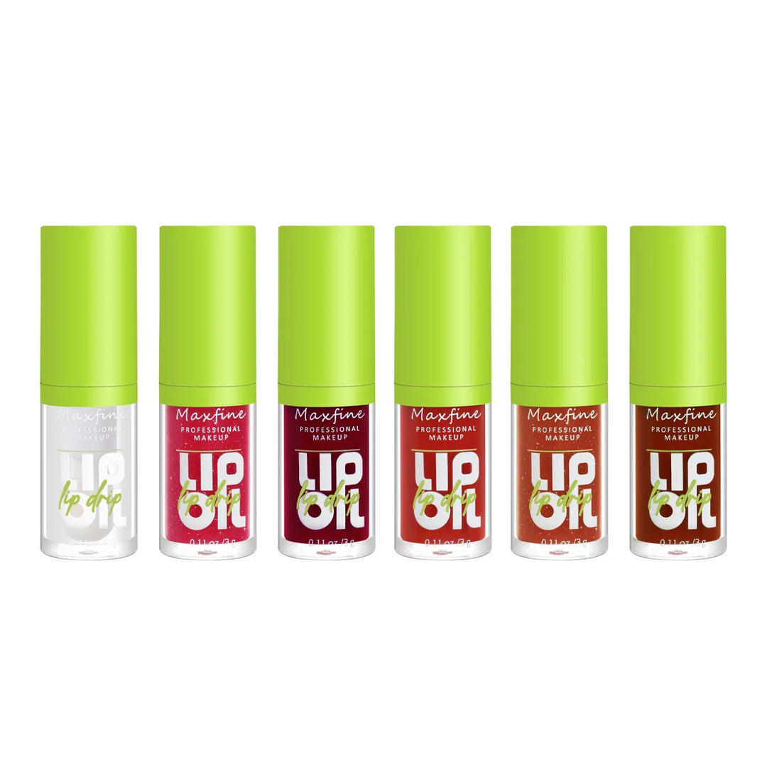 Six Maxfine professional makeup lip oil bottles in various shades with green caps on white background