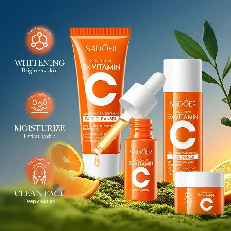 Sadöer Skin Active 5x Vitamin C skincare set with face cleanser, serum, toner, and cream on moss with orange slices