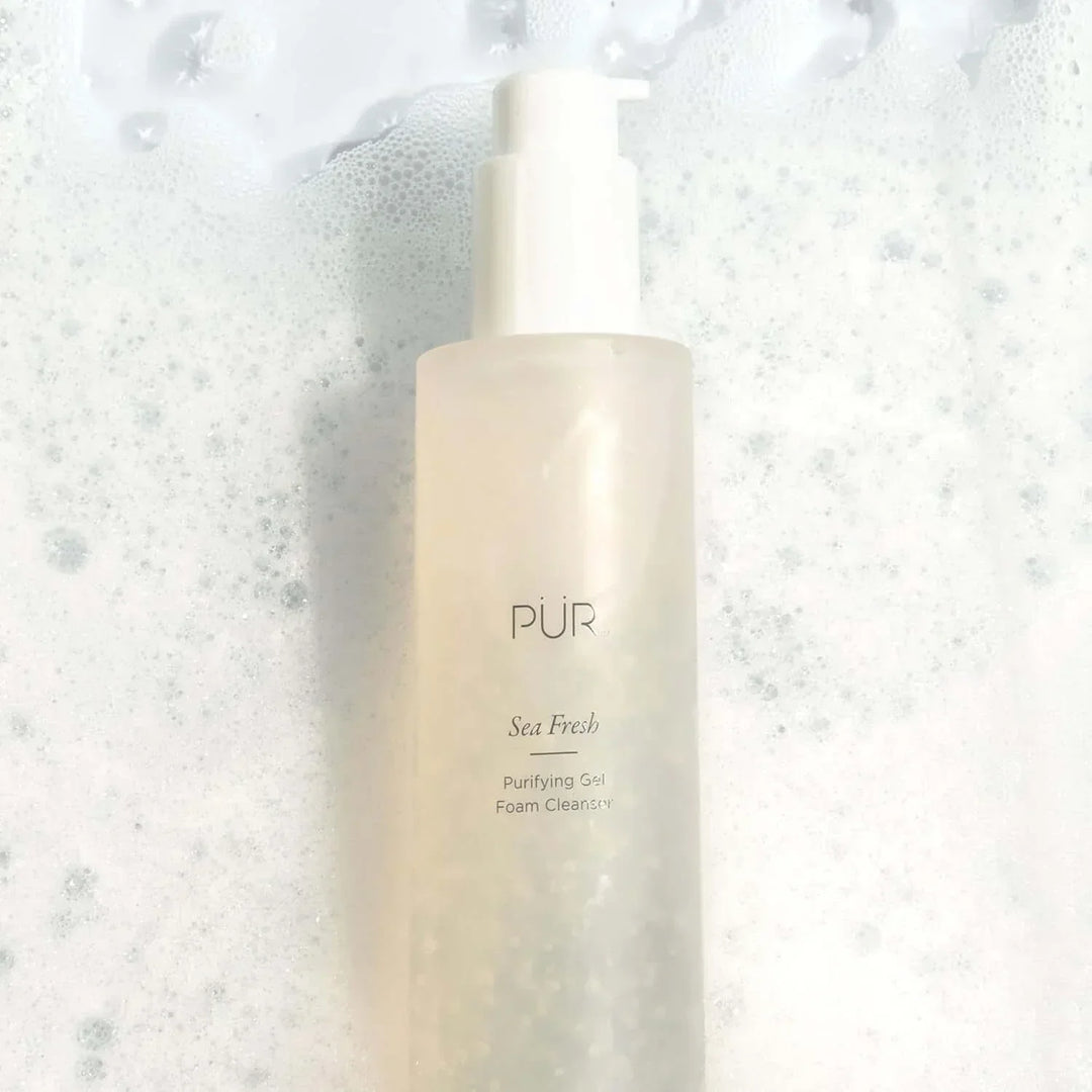 PÜR Sea Fresh Purifying Gel Foam Cleanser bottle surrounded by white foam bubbles