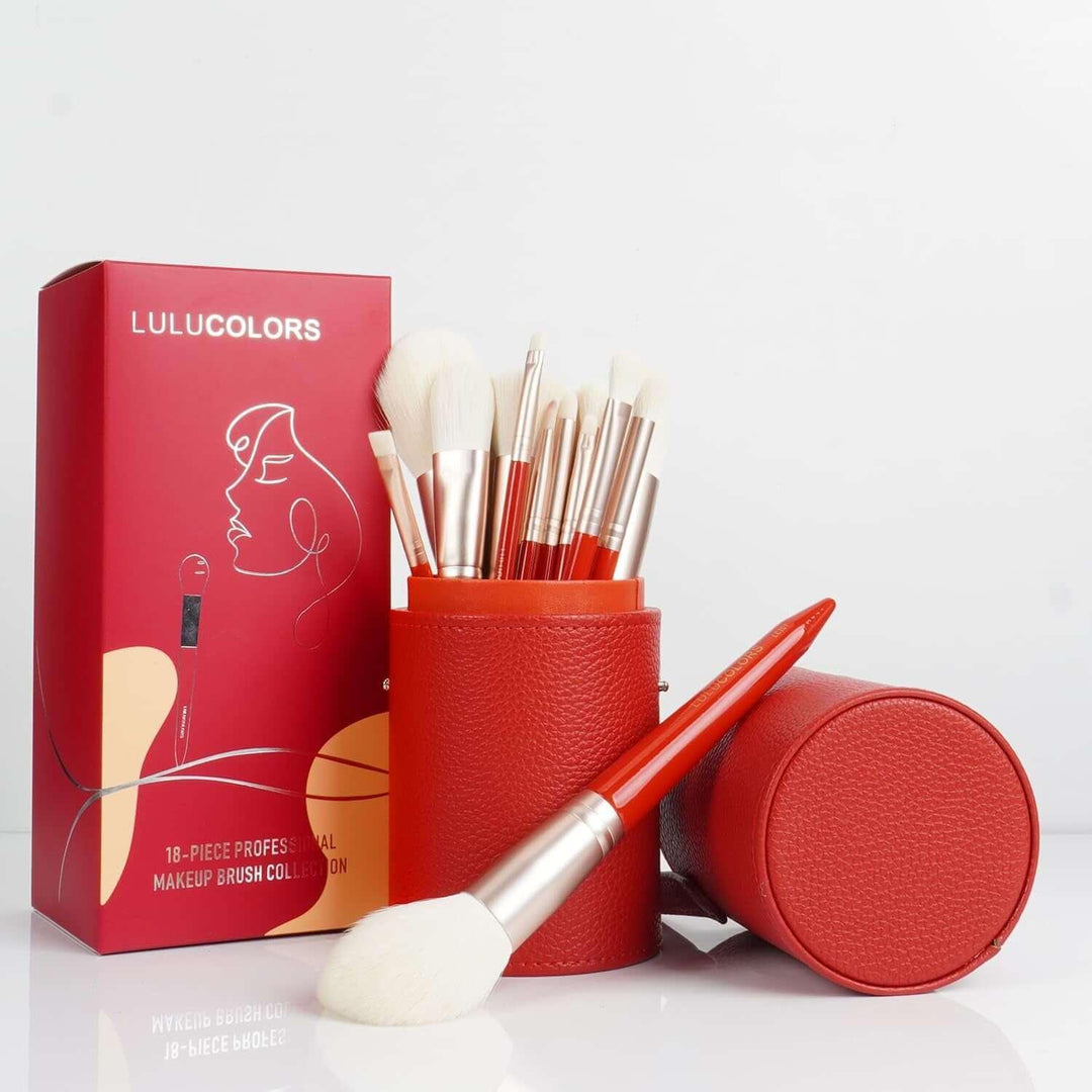 LULUCOLORS 18-piece professional makeup brush set with red handles and white bristles in a red leather case